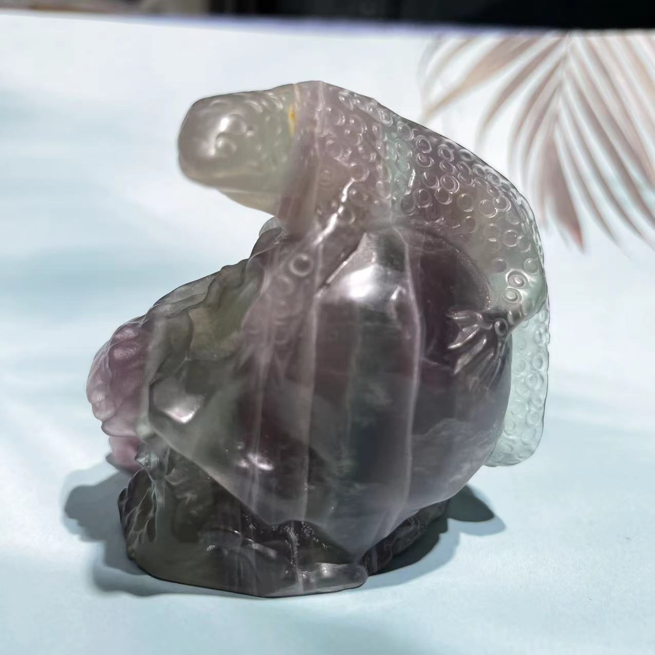 Fluorite skull with lizard on top