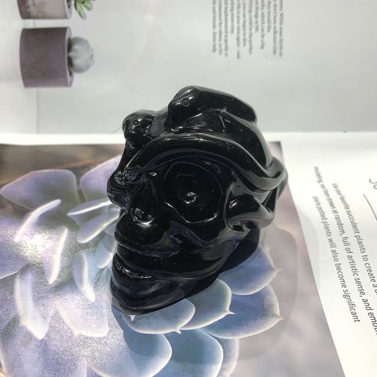Snake skull obsidian carving