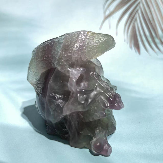 Fluorite skull with lizard on top